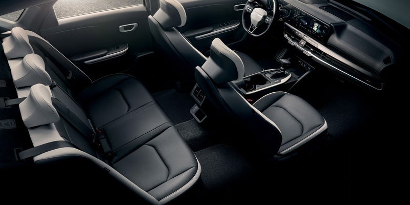 Kia K4 Hatchback five-door model showing floating roof design and rear cargo area
